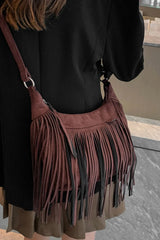 Woman wearing a Suede Fringe Adjustable Strap Shoulder Bag with fringes, showcasing the bag's stylish design and adjustable strap.